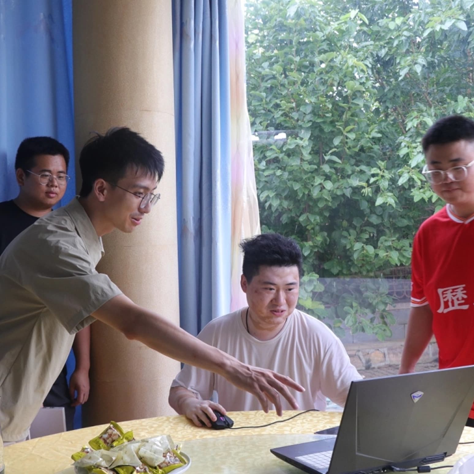 AM staff working together at a laptop